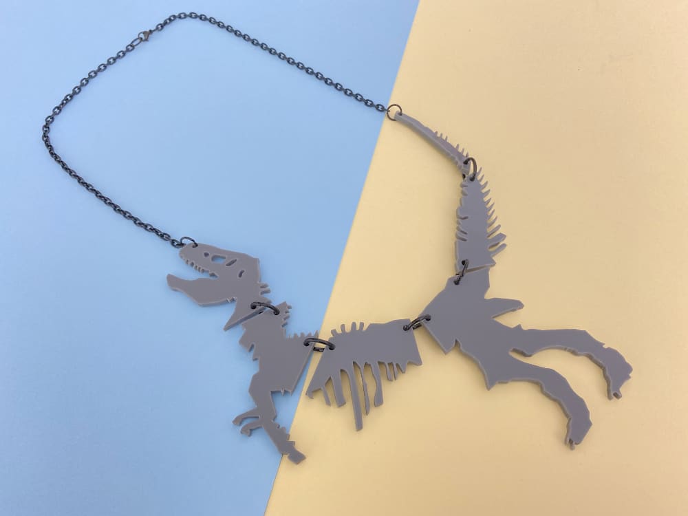 grey dinosaur necklace