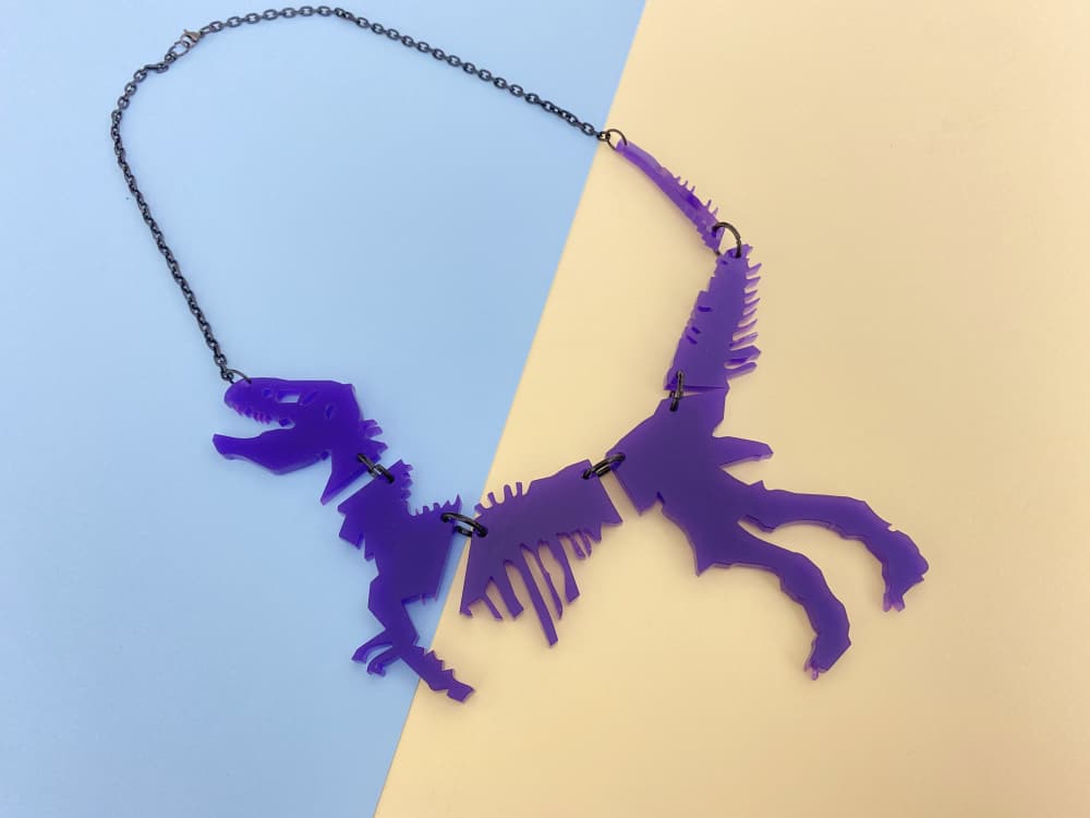 violet dinosaur necklace