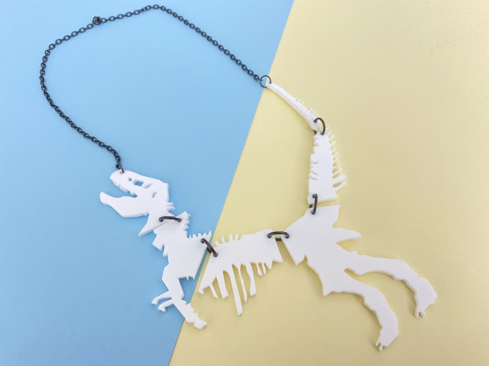 white dinosaur necklace